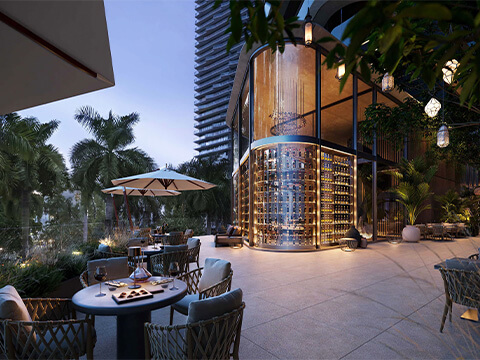 Outdoor wine terrace at Ora by Casa Tua Miami with illuminated bottle display and skyline setting