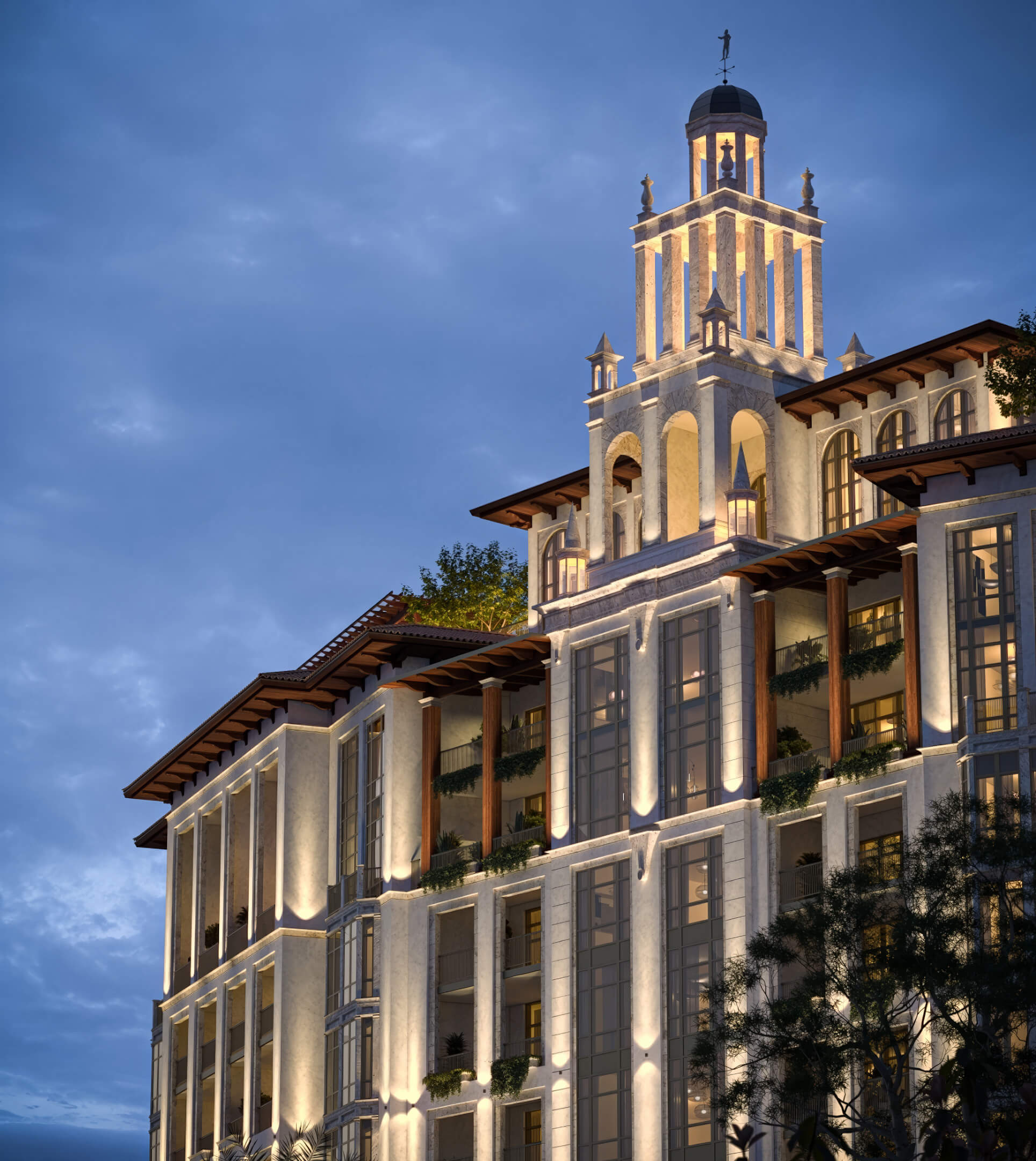 Illuminated architectural exterior of Ponce Park Residences in Coral Gables at dusk