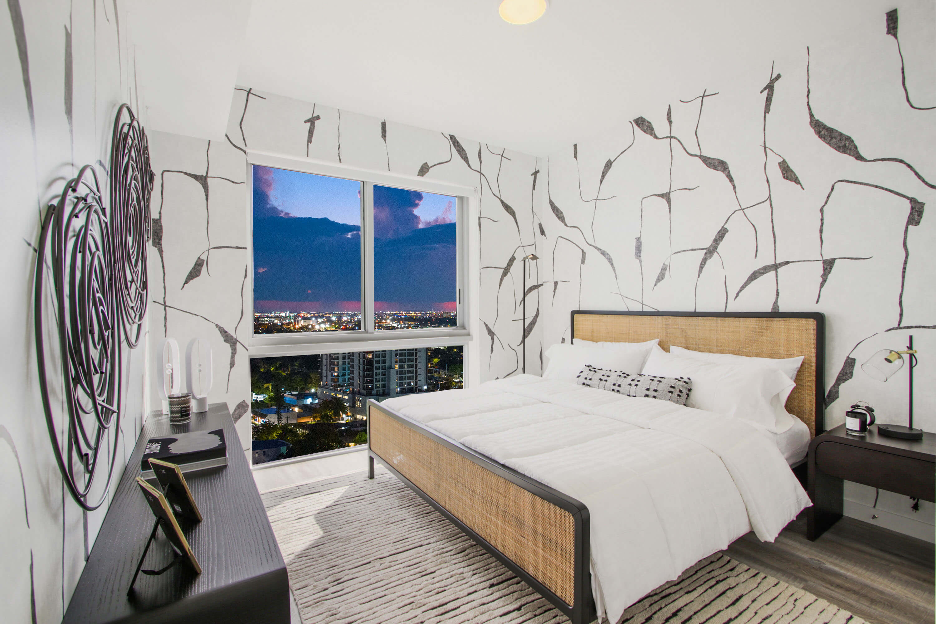 Artistic bedroom with pattern wall and night city view at River District 14