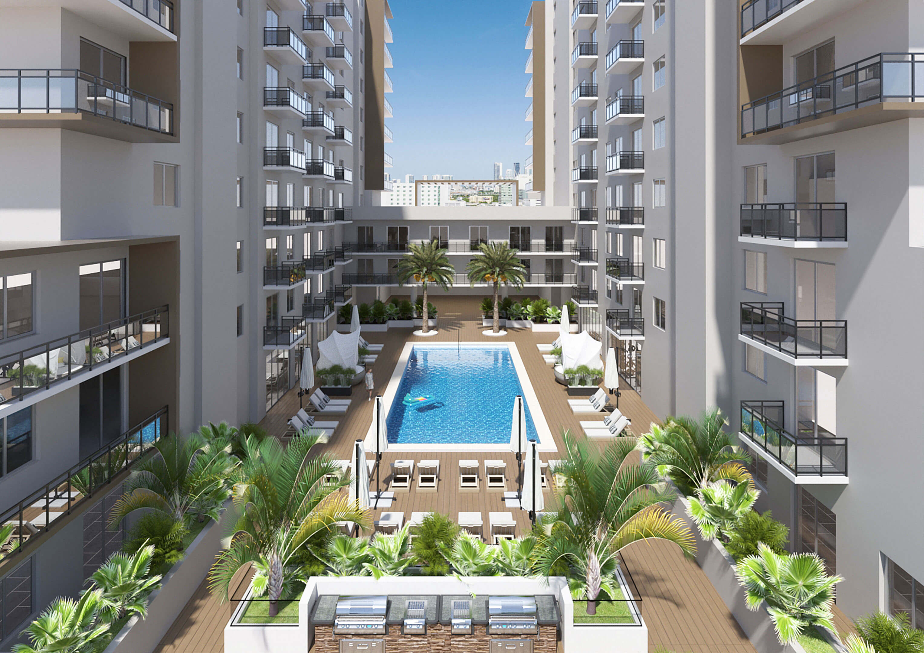 Central courtyard with pool and lounge area at River District 14 residences