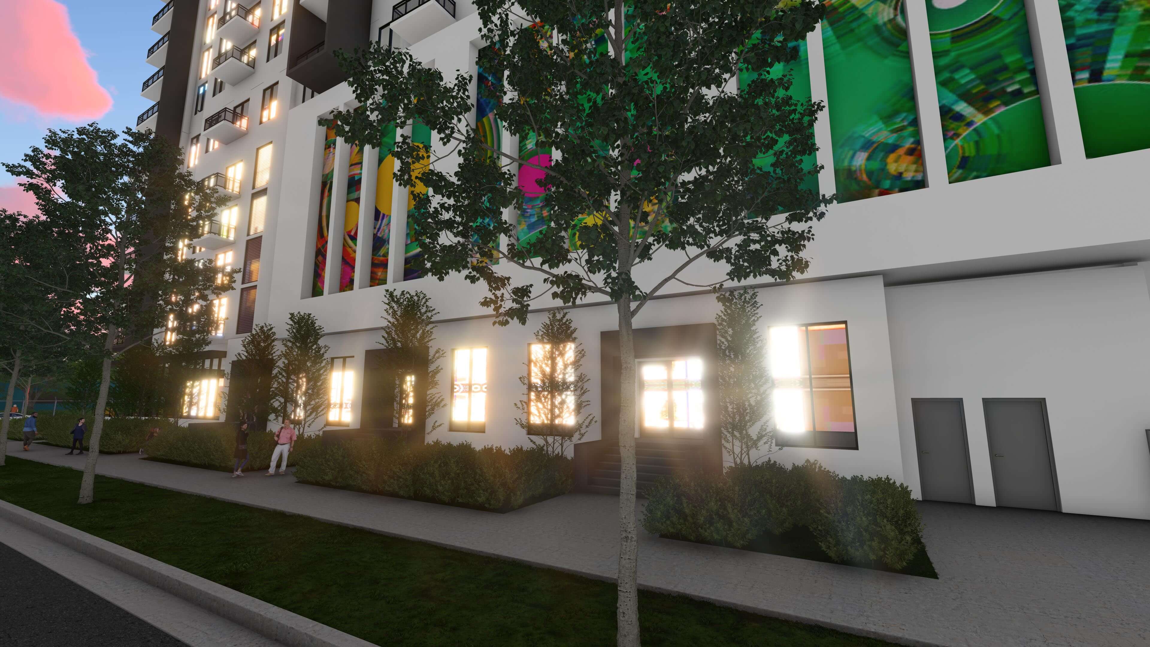 Evening glow on River District 14 windows with colorful mural and street view
