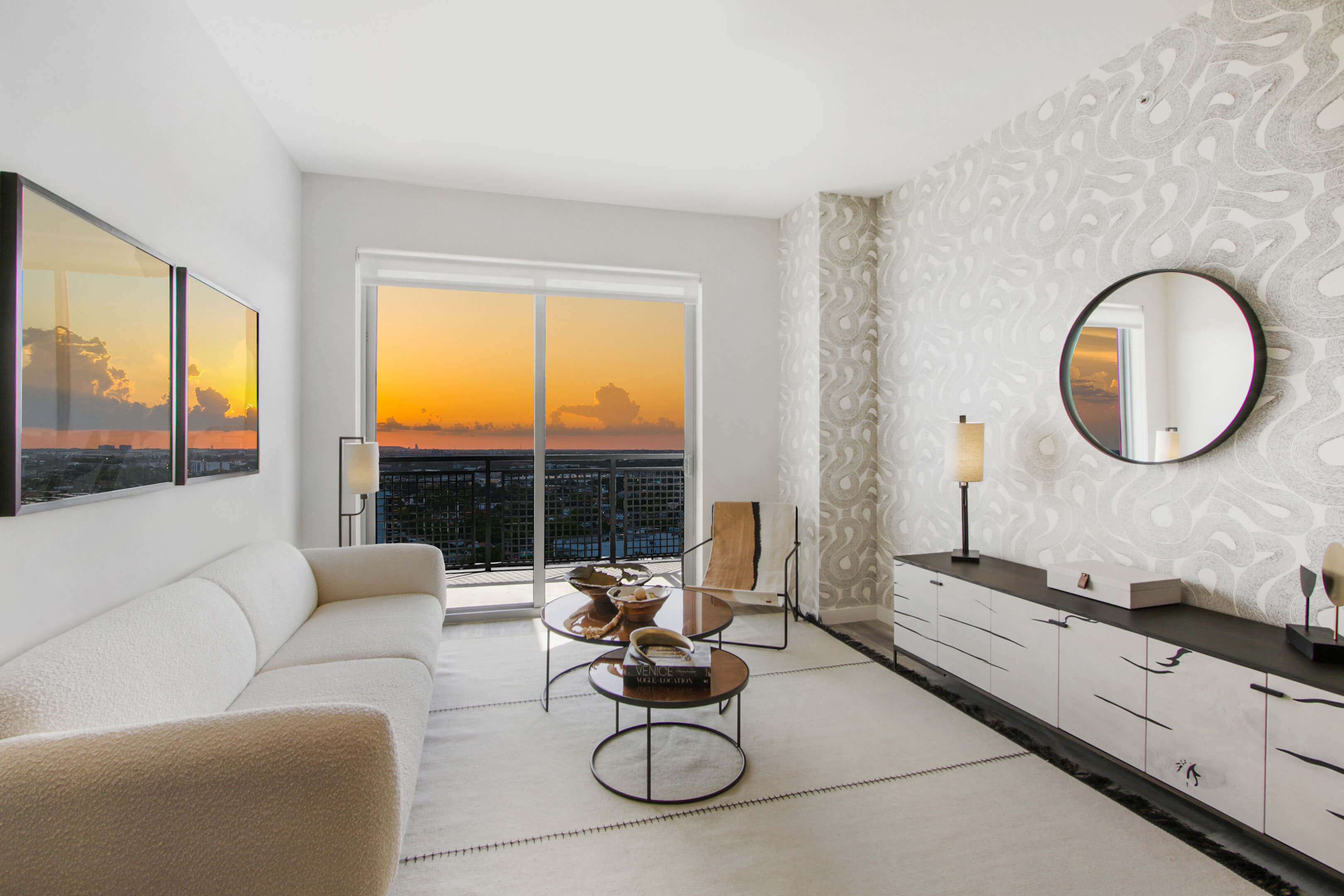 Stylish living area with sunset skyline view at River District 14
