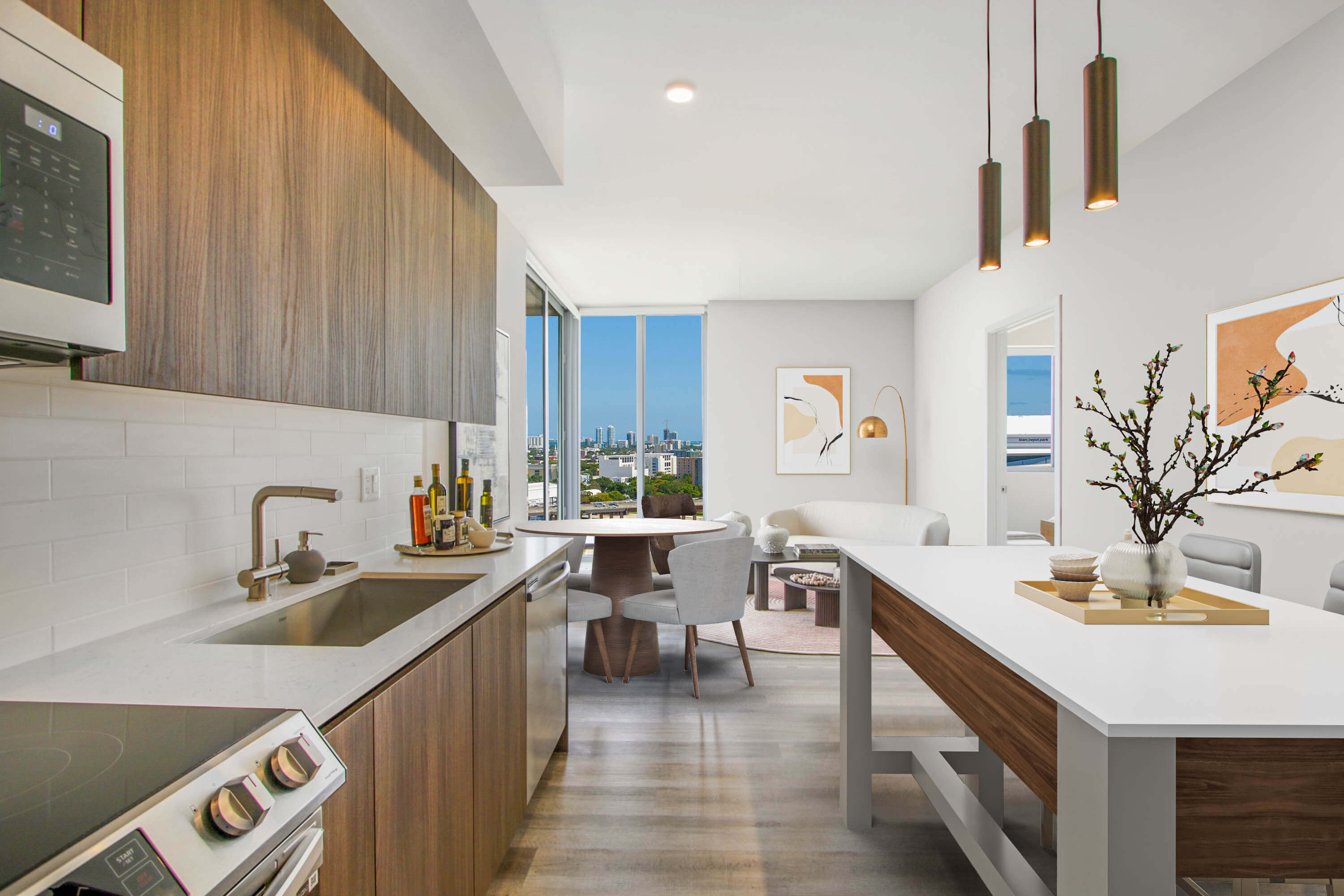 Modern kitchen with dining area and panoramic city view at River District 14