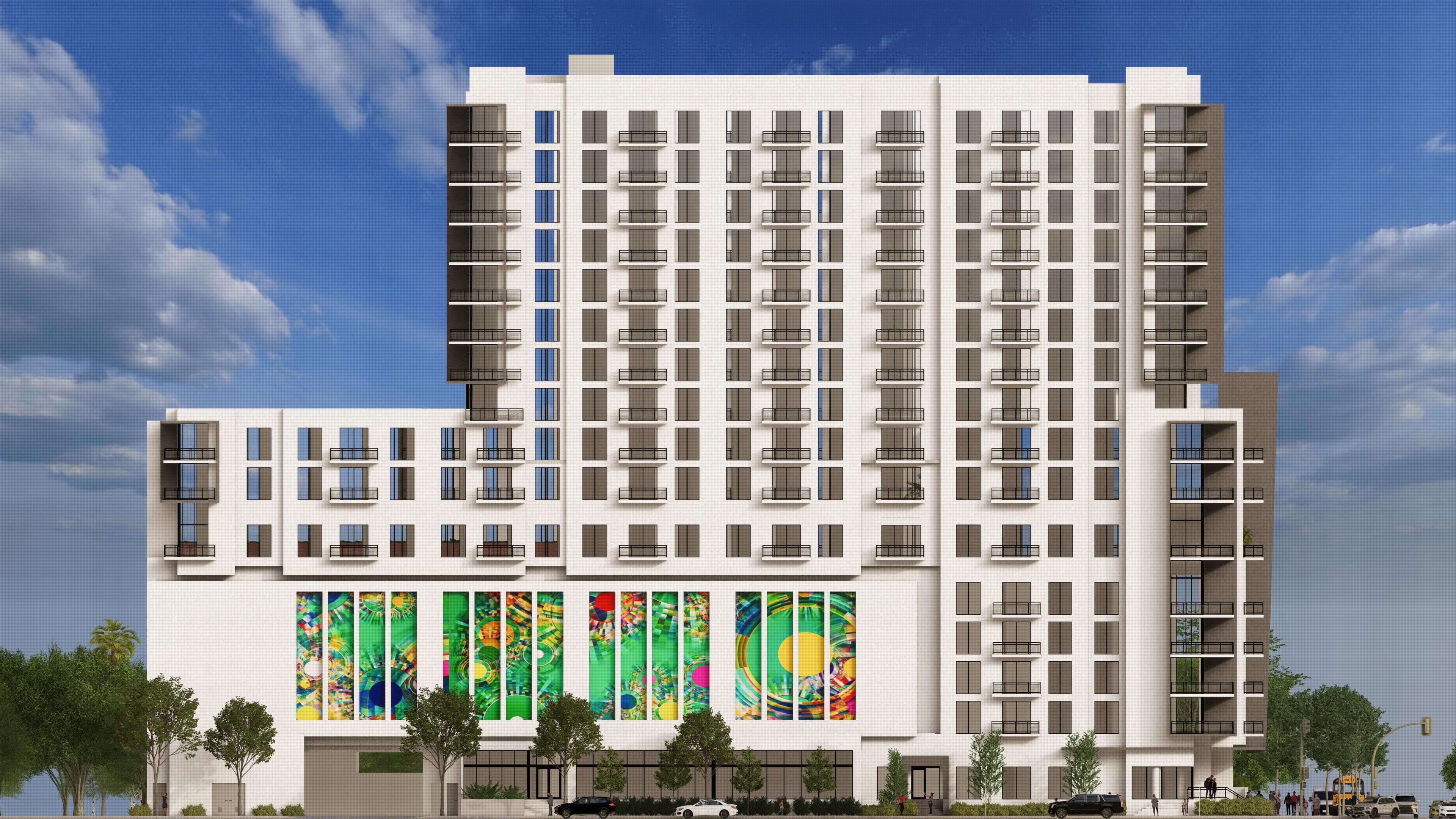 Side angle of River District 14 highlighting detailed mural and residential balconies