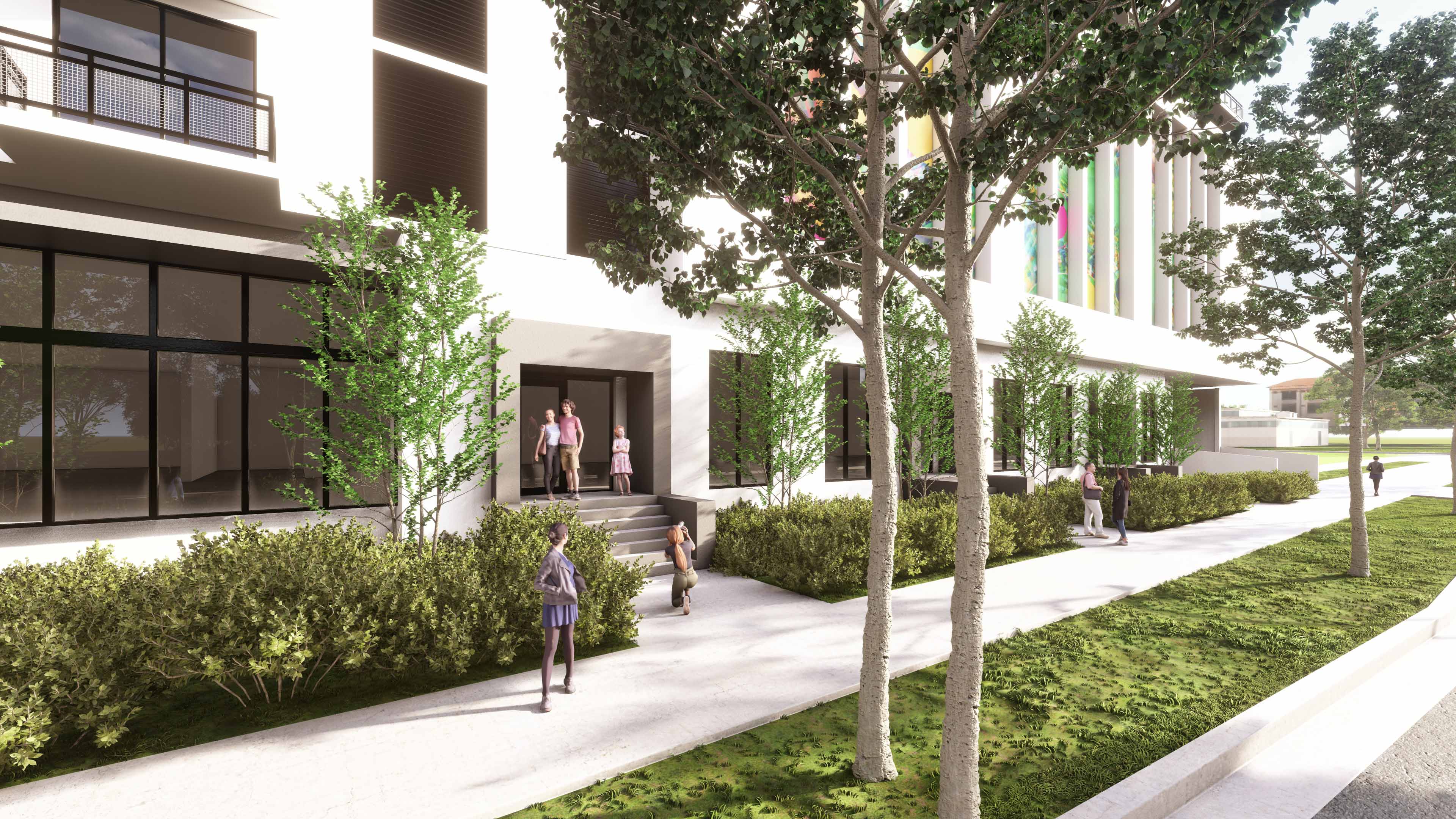 Pedestrian access to River District 14 surrounded by trees and landscaped walkway