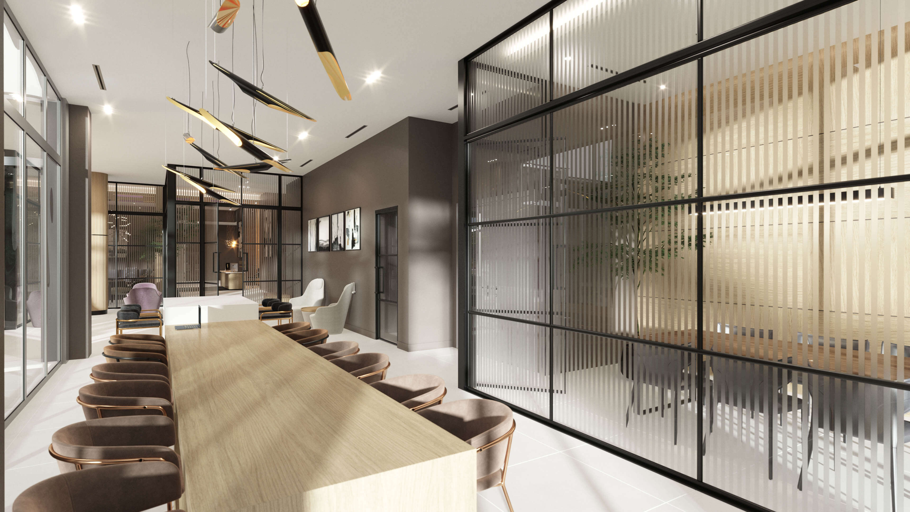 Shared working lounge with long table and design lighting at River District 14
