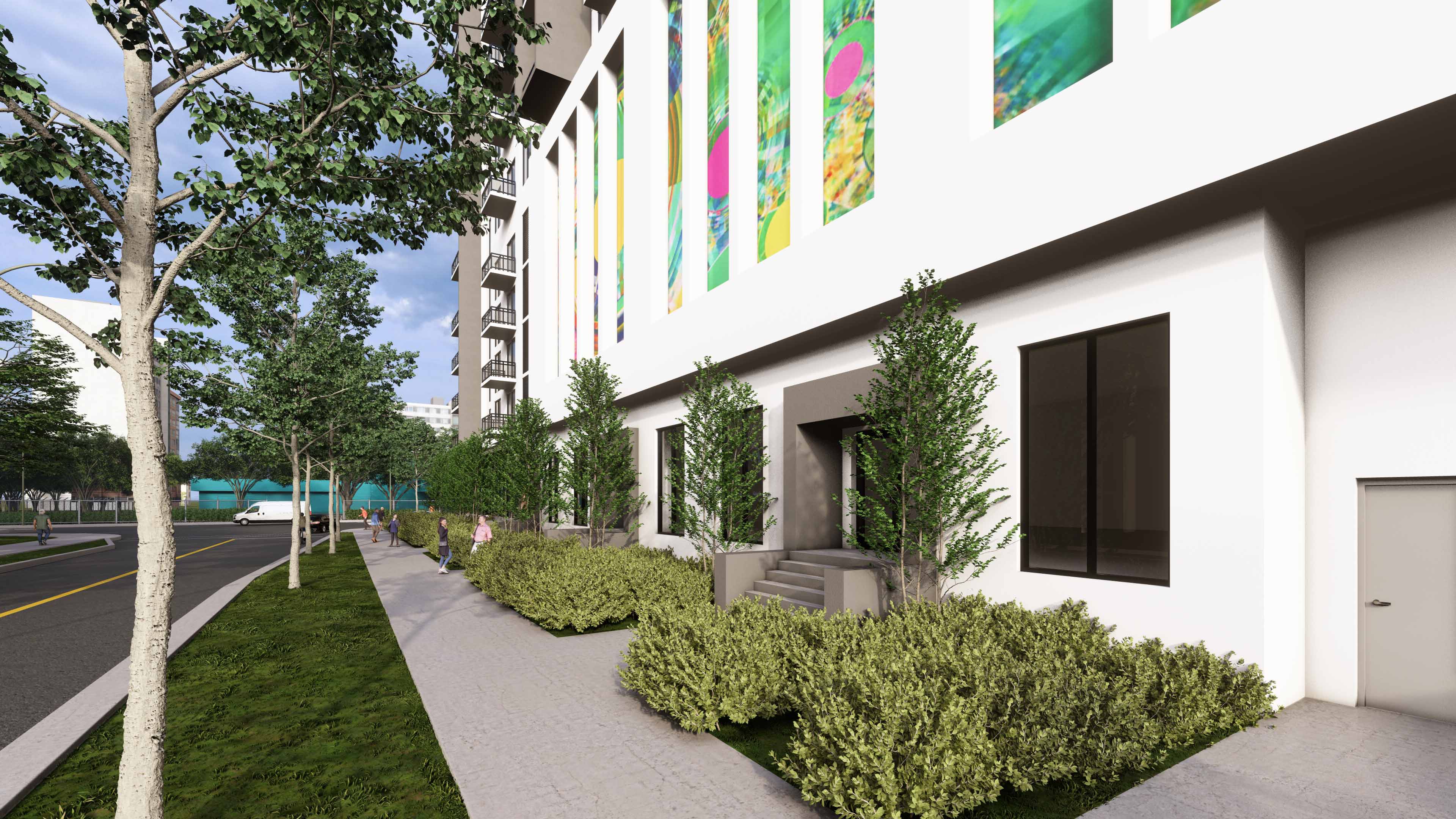 Side pathway and access door of River District 14 with lush landscaping