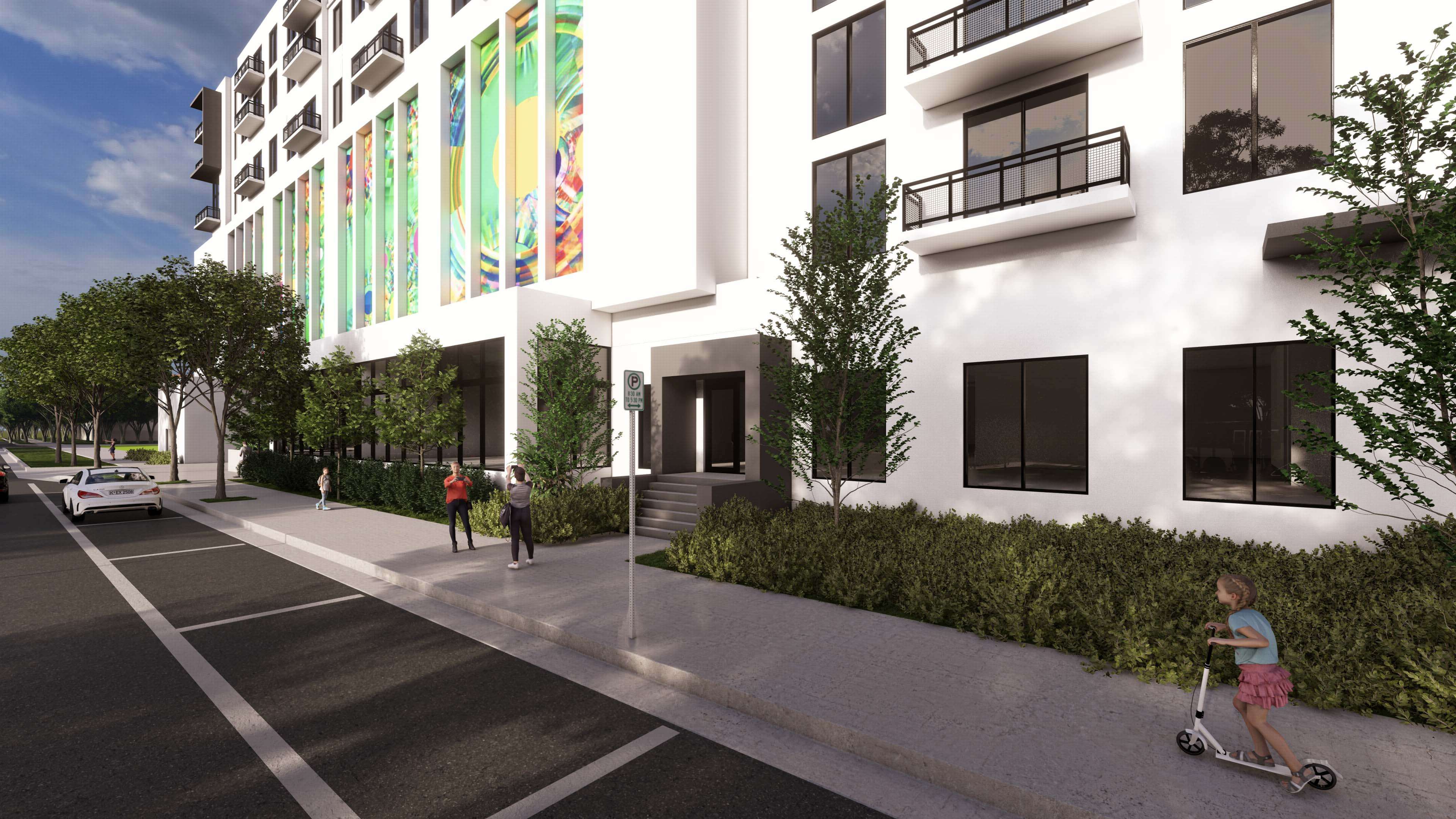 Sidewalk view of River District 14 with kids, modern facade and mural details