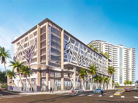 Modern retail podium and residential tower at Shoma Bay in North Bay Village
