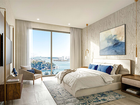 Waterfront bedroom interior with bay views at Shoma Bay in North Bay Village