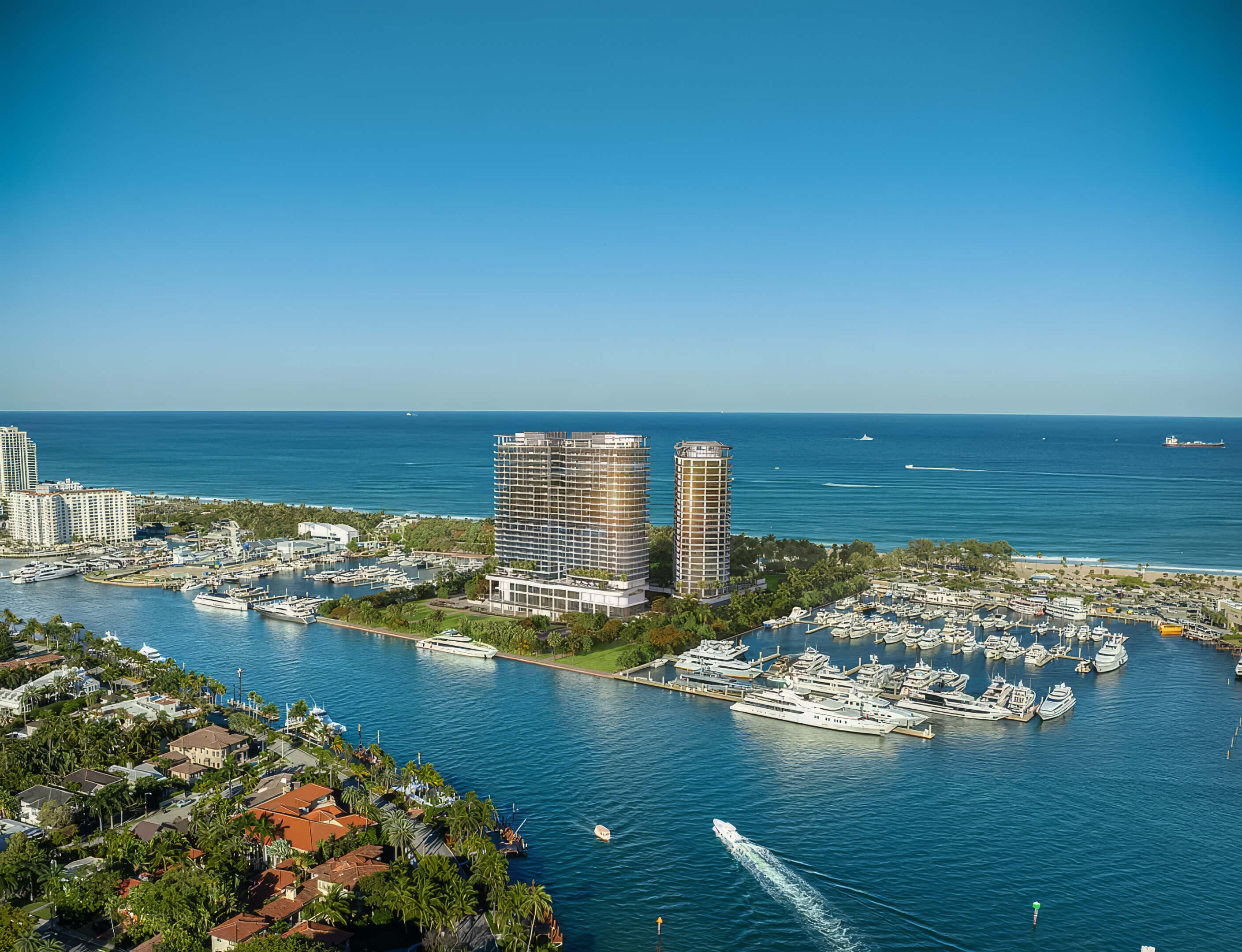 Aerial view of the towers, marina and ocean at St Regis Residences Bahia Mar