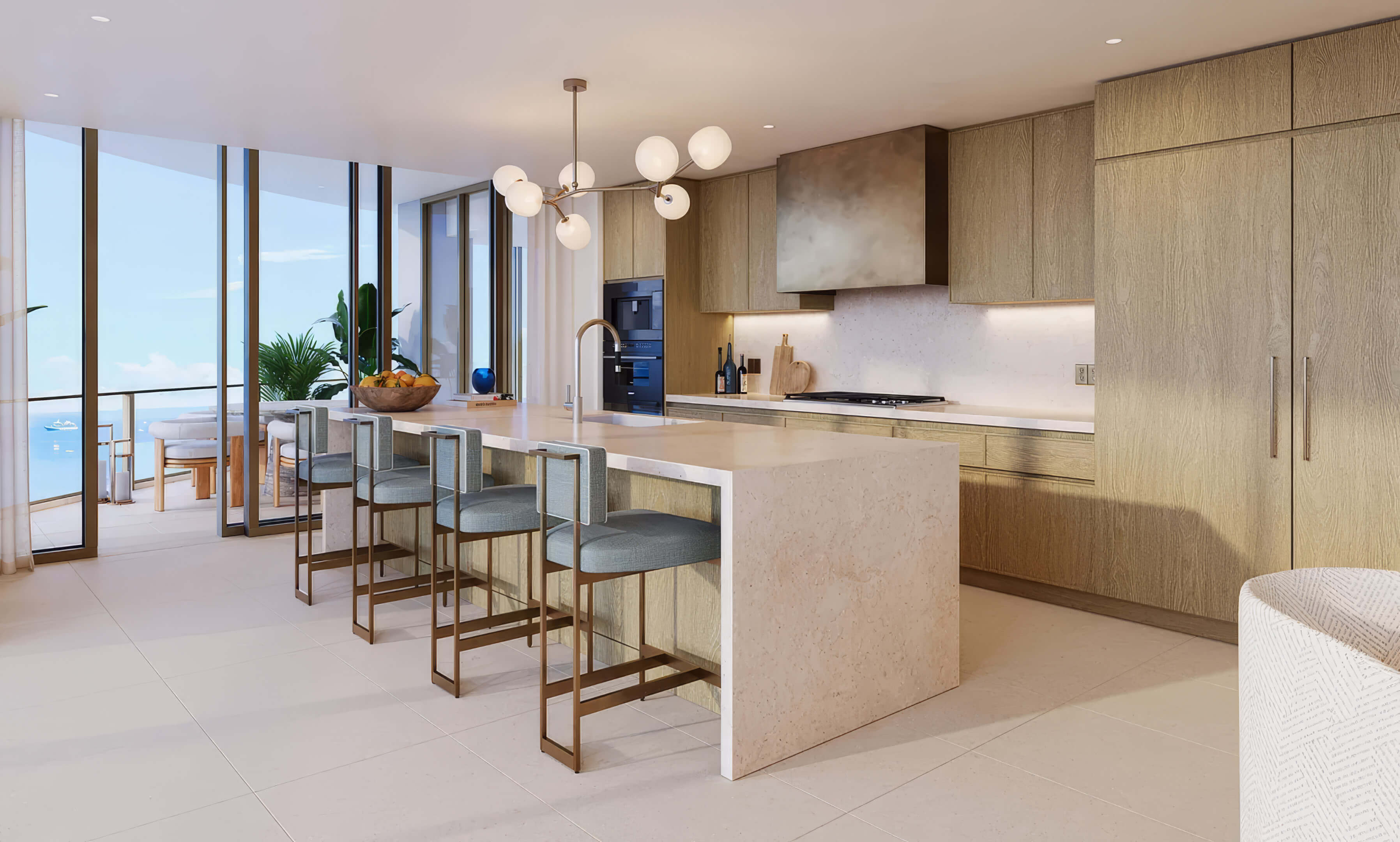 Kitchen island with bar seating beside corner windows and a balcony at St Regis Residences Bahia Mar