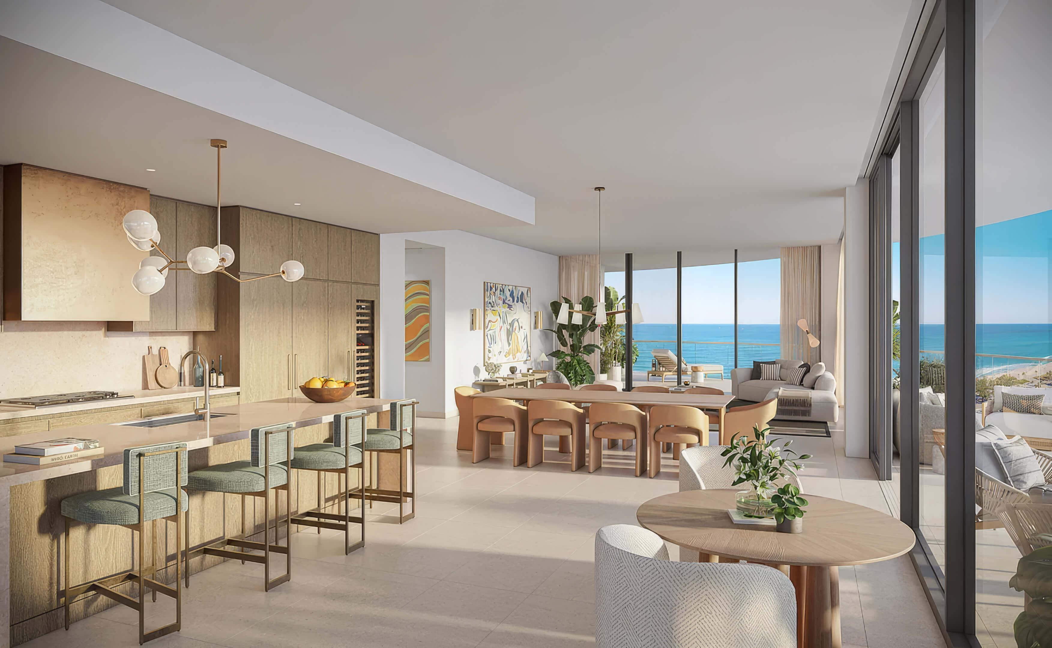 Open kitchen with island seating, a dining table and ocean views at St Regis Residences Bahia Mar