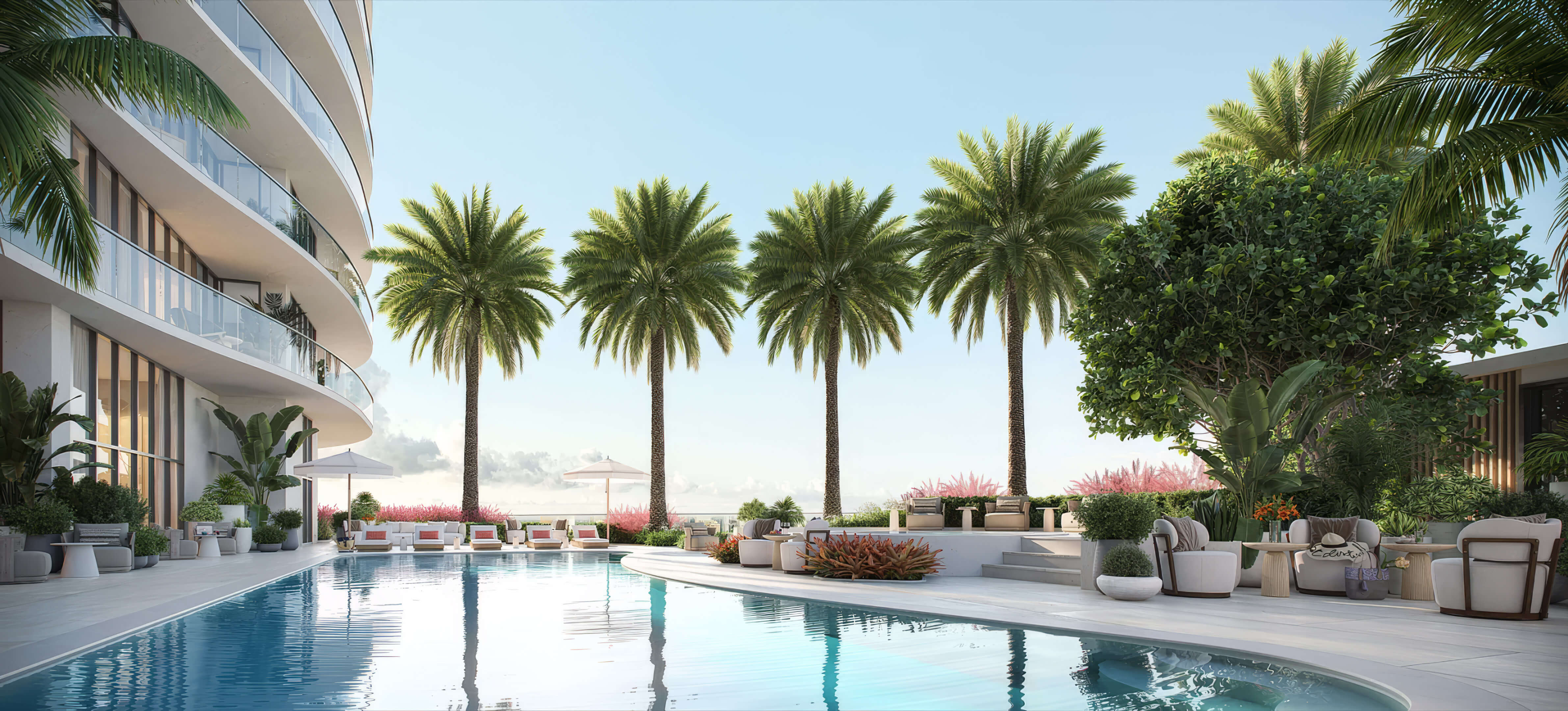 Outdoor pool beside curved balconies, palm trees and shaded seating at St Regis Residences Bahia Mar