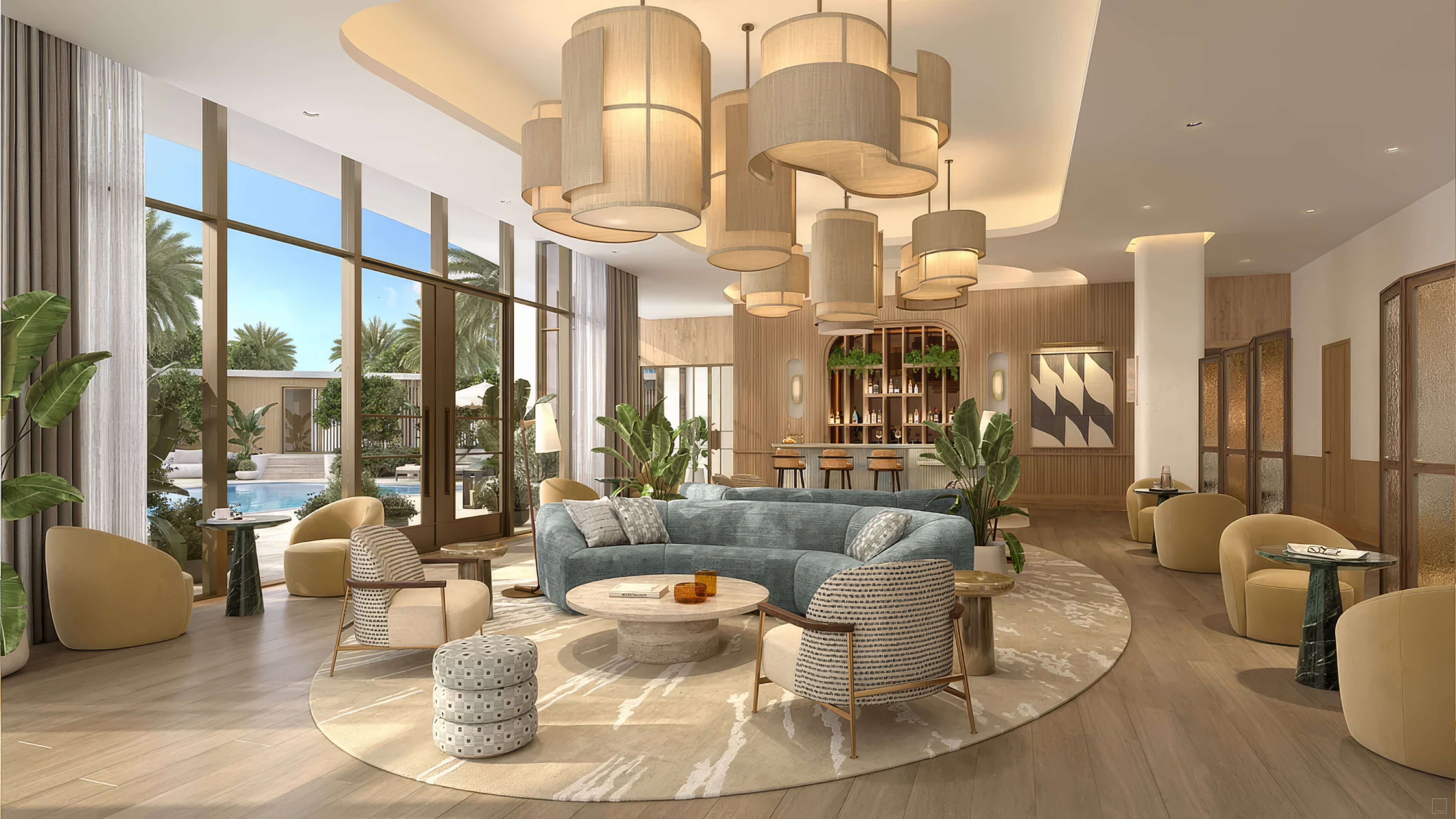 Residents lounge with a curved sofa, clustered pendant lights and a bar at St Regis Residences Bahia Mar