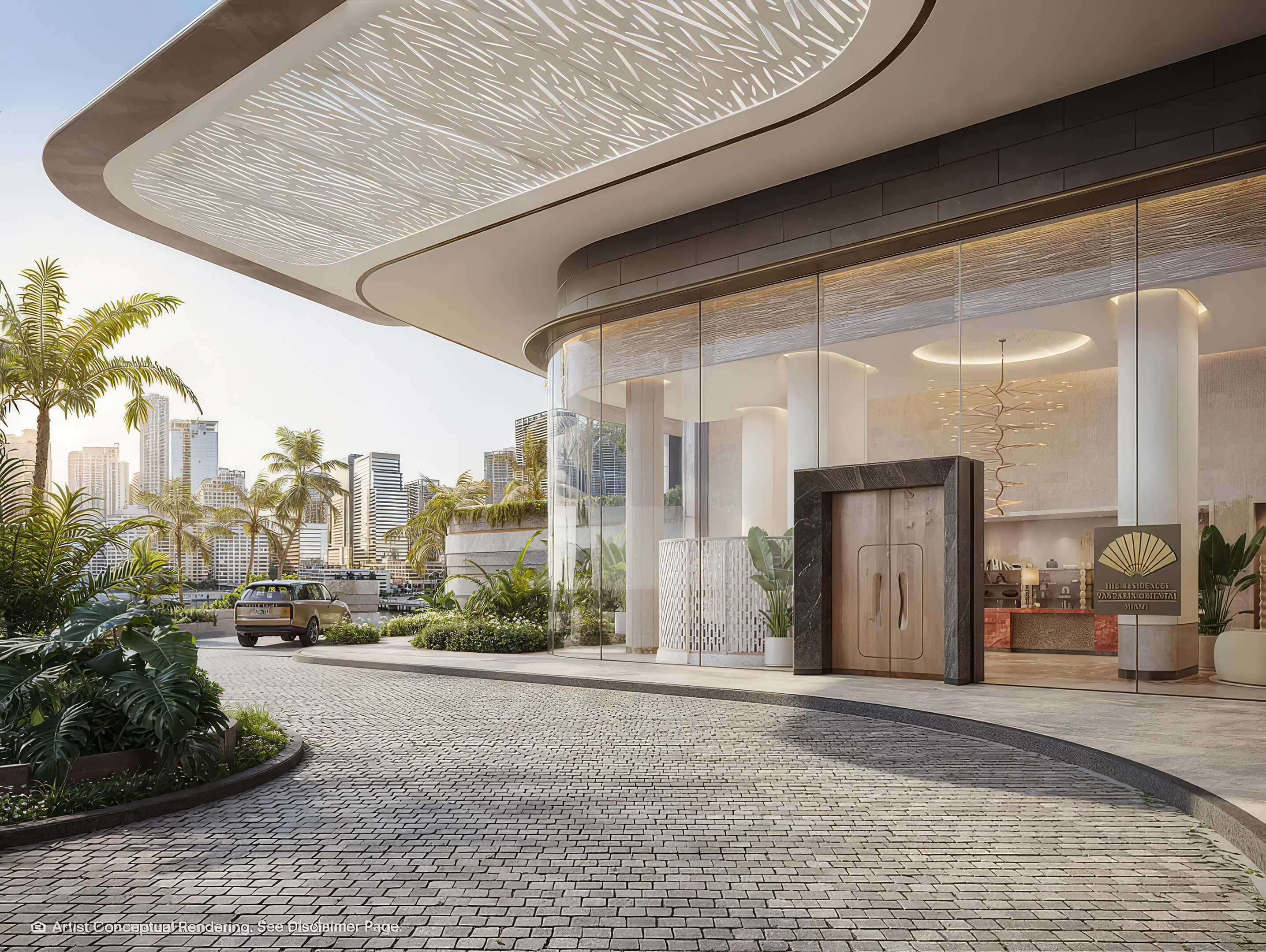 Grand arrival entrance at The Residences Mandarin Oriental with tropical landscaping