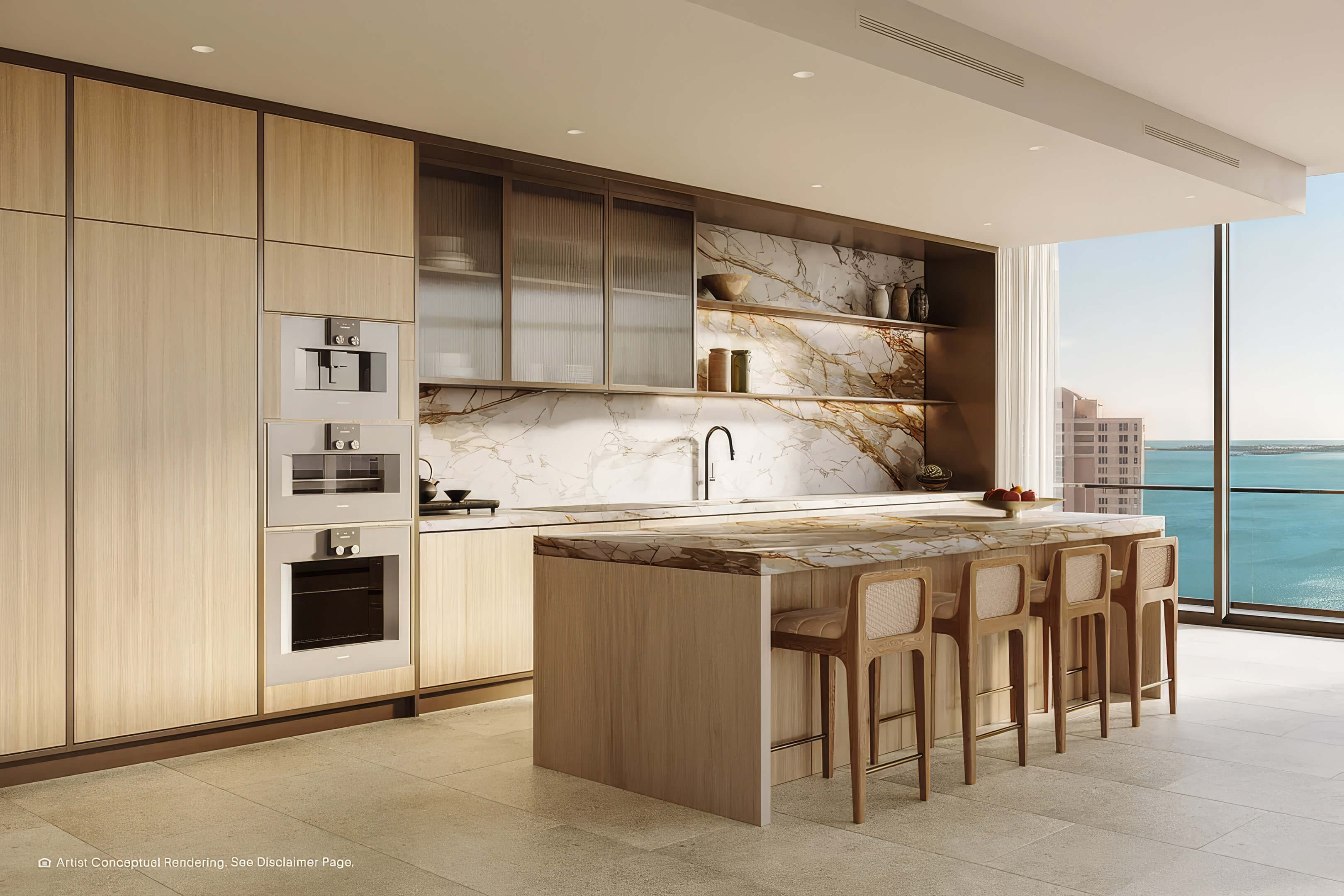 Luxury waterfront kitchen at The Residences Mandarin Oriental with marble island and bay views