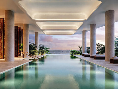 Indoor luxury pool at The Residences Mandarin Oriental with serene waterfront views