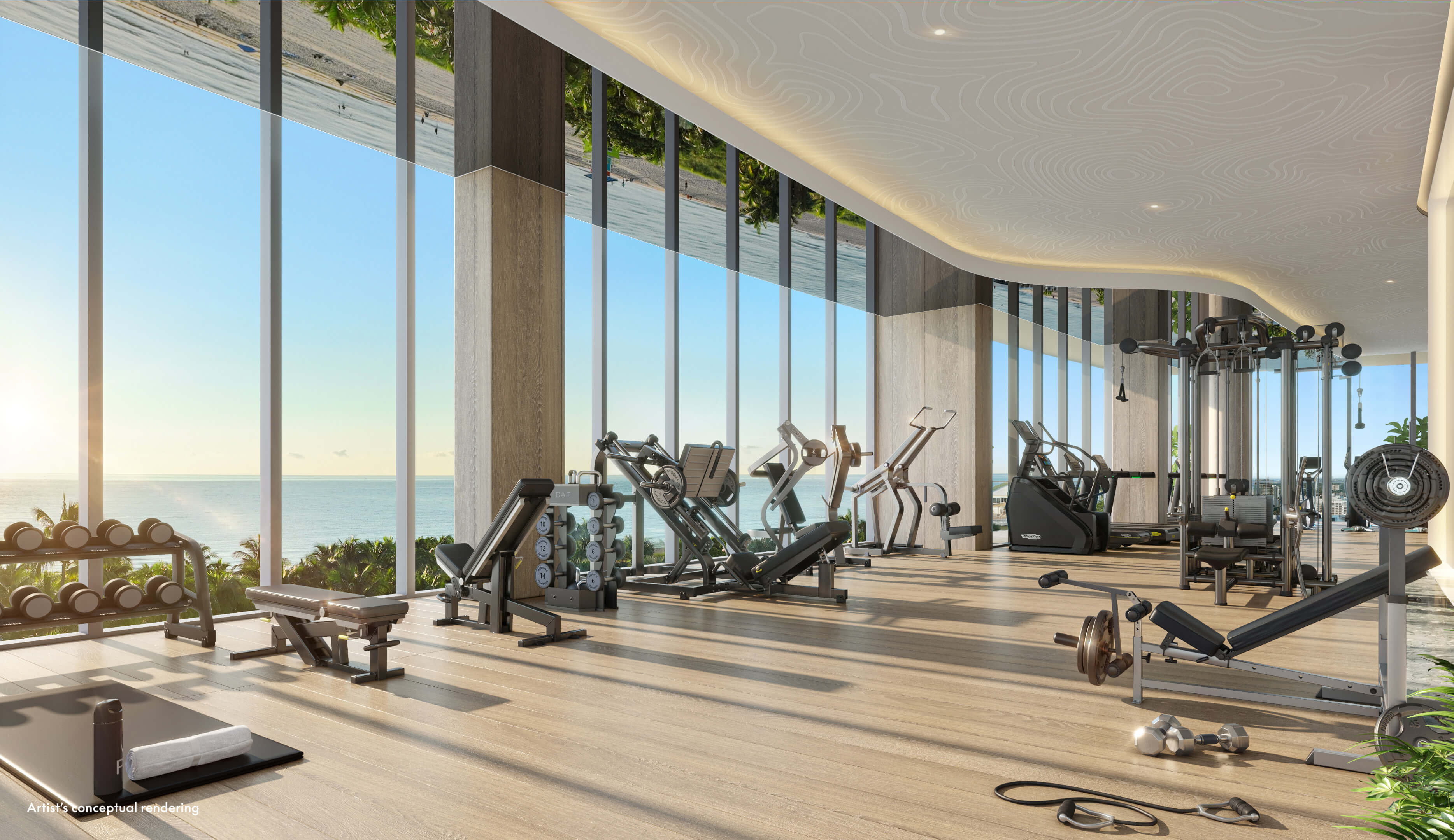 Spacious W Pompano Beach gym with full equipment setup and floor-to-ceiling windows