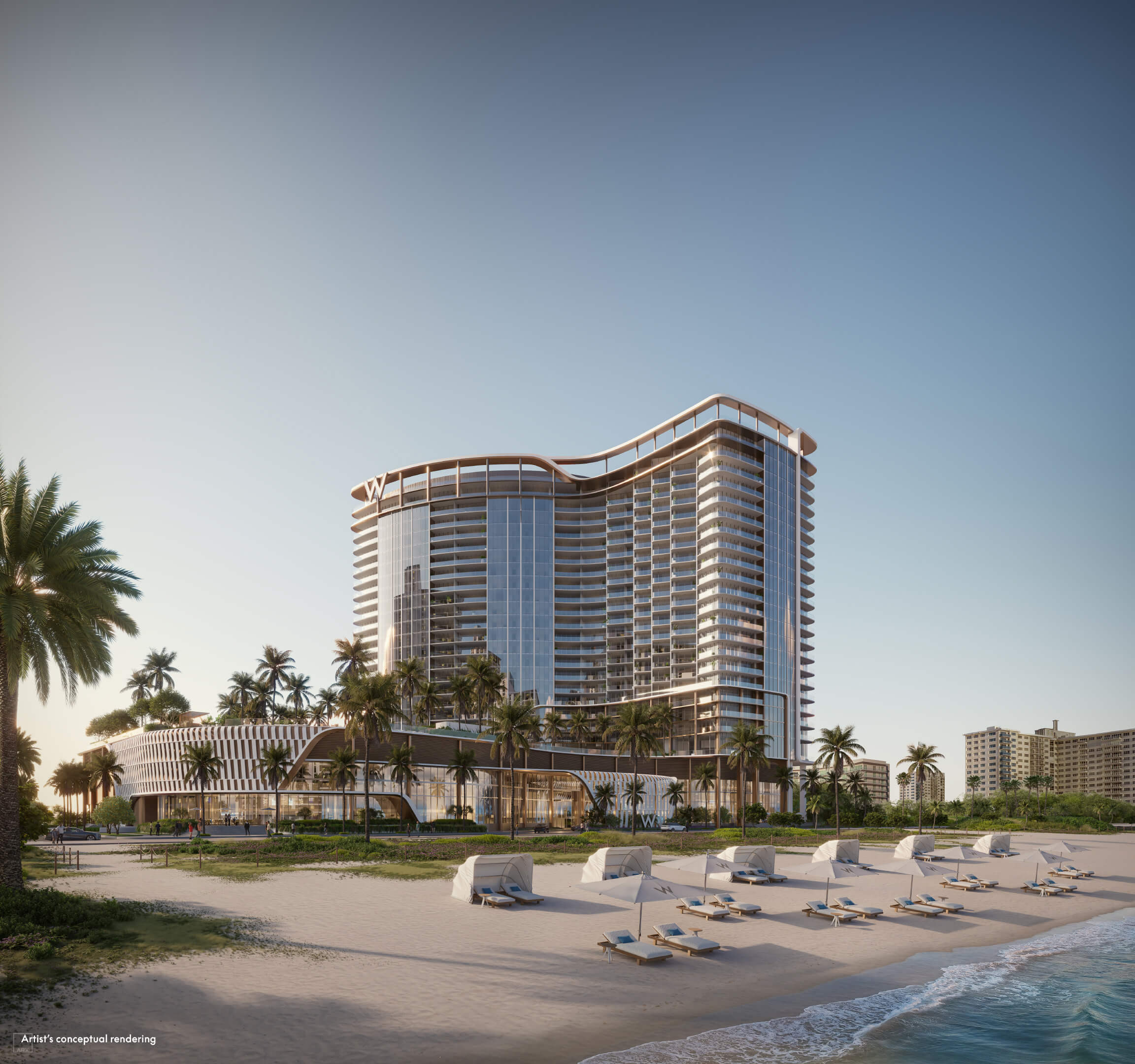 W Pompano Beach beachfront tower at sunset with lounge chairs and palm-lined coast
