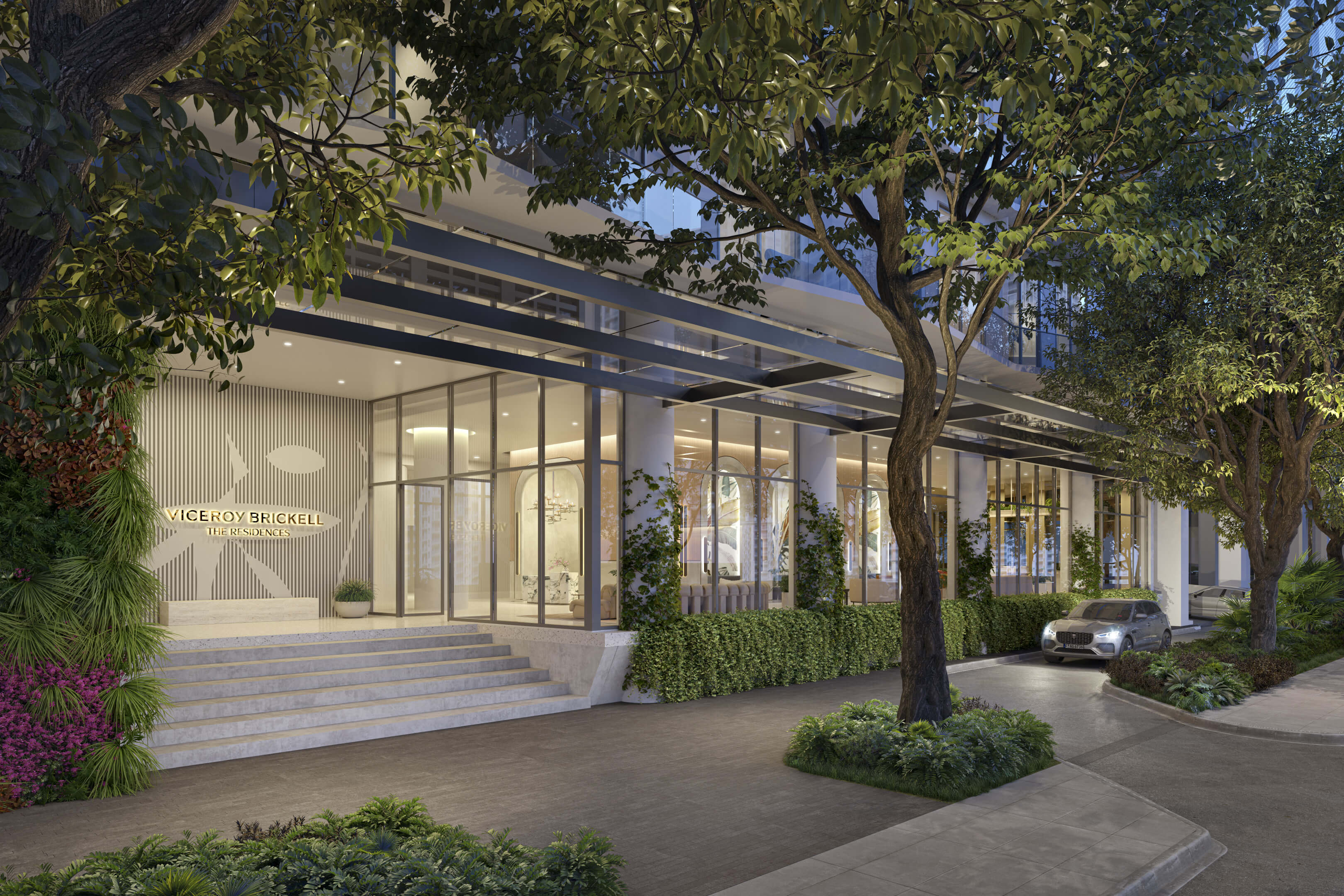 Elegant evening view of the luxury lobby entrance at Viceroy Brickell with lush landscaping