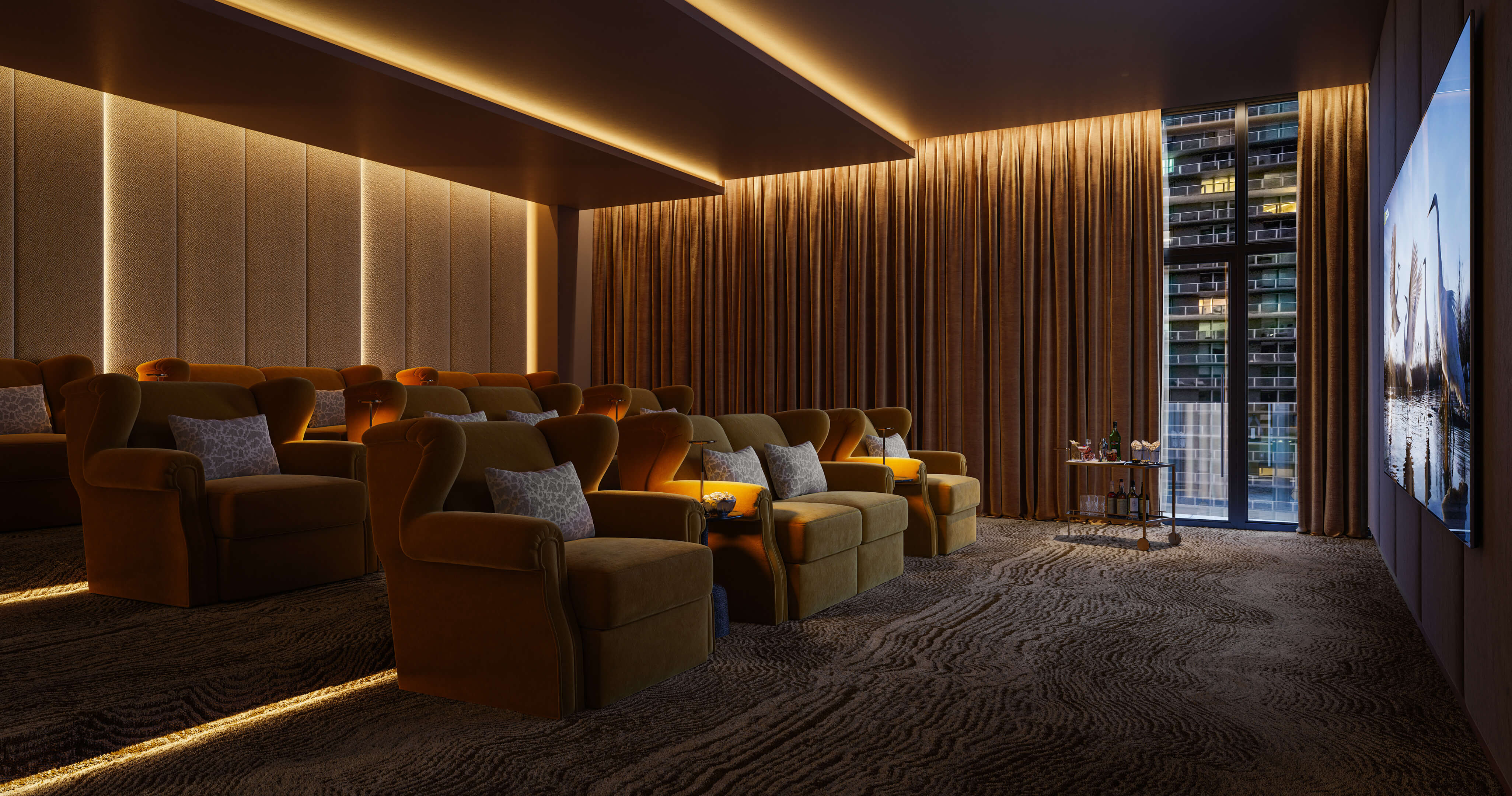 Private cinema room with plush seating and immersive screen at Viceroy Brickell